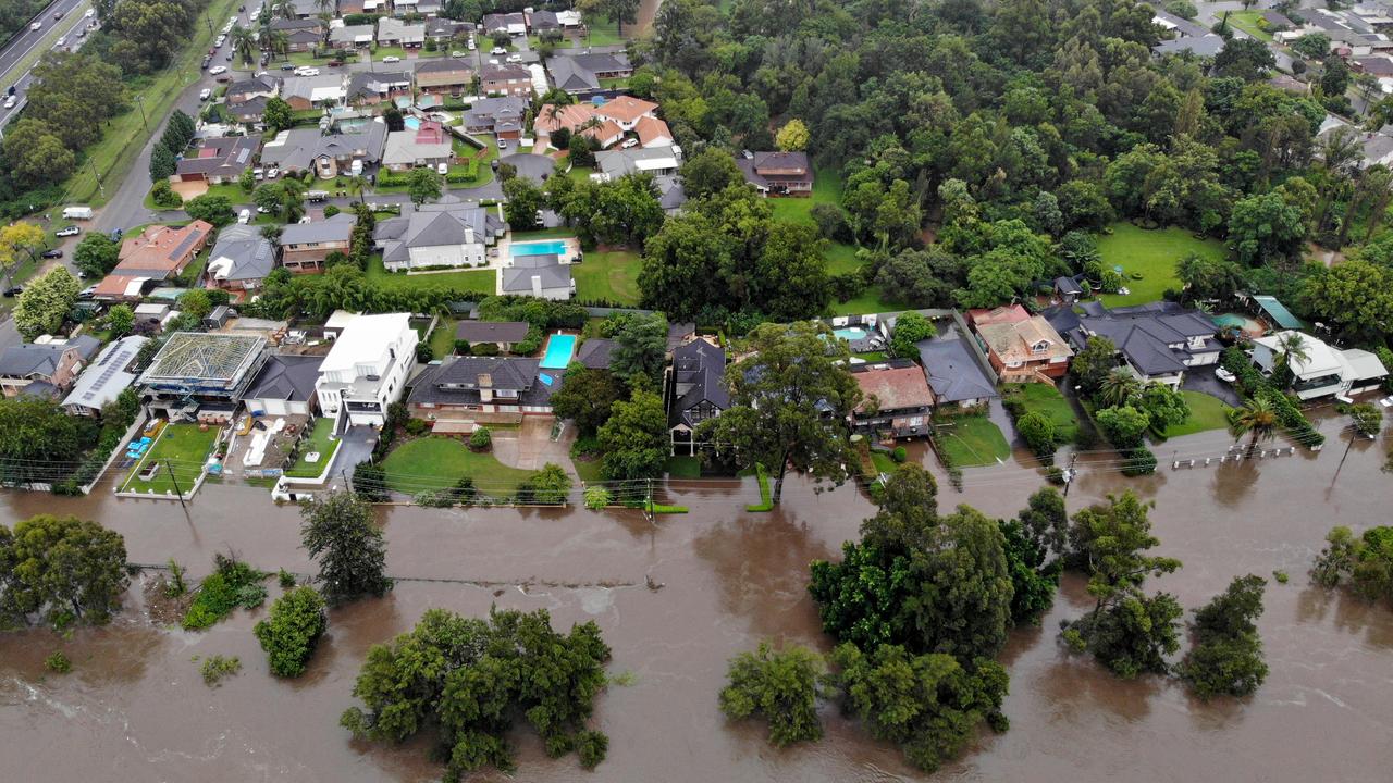 Rising flood waters threaten homes along River Rd in Emu Plains. Picture: Toby Zerna