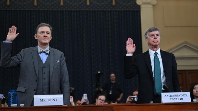 George Kent, the deputy assistant secretary of state for European and Eurasian Affairs and Ukrainian Ambassador Bill Taylor(R), the top diplomat in the US embassy in Ukraine take the oath during the impeachment inquiry into US President Donald Trump. Picture: AFP