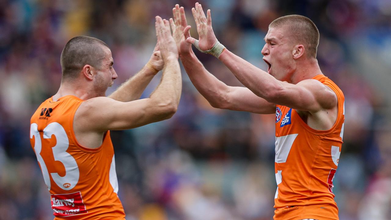 BRISBANE, AUSTRALIA - AUG 11: Max Gruzewski of the Giants celebrates a goal during the 2024 AFL Round 22 match between the Brisbane Lions and the GWS GIANTS at The Gabba on August 11, 2024 in Brisbane, Australia. (Photo by Russell Freeman/AFL Photos via Getty Images)