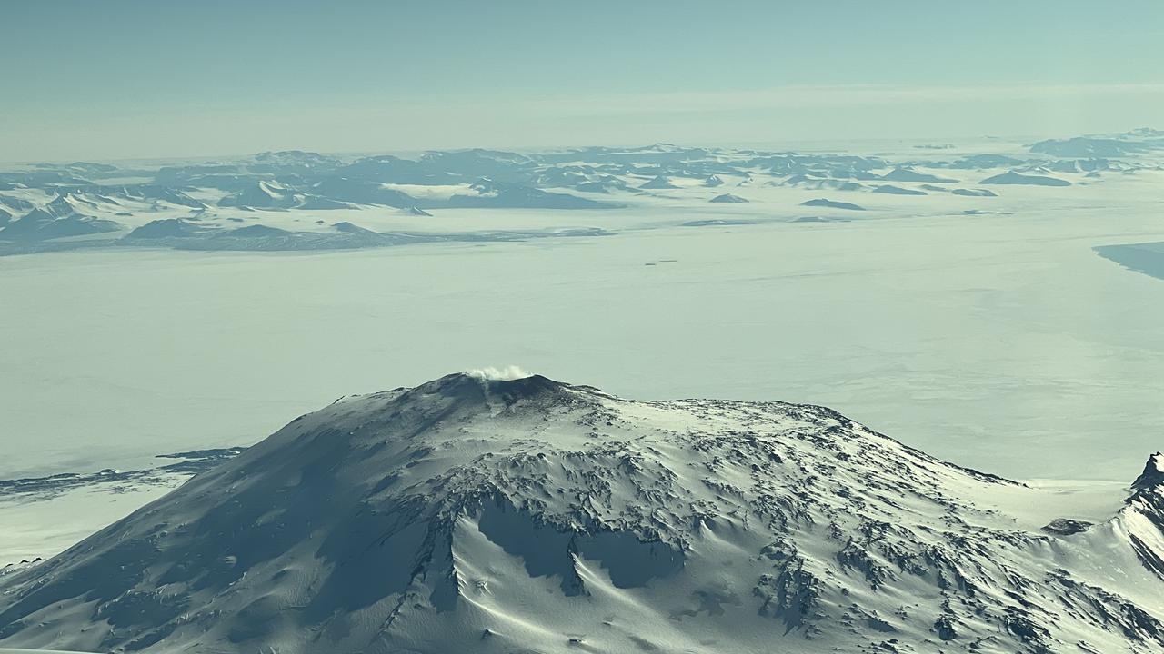 Mount Erebus, the highest active volcano in Antarctica, seen out the plane window. Picture: Chantelle Francis / news.com.au