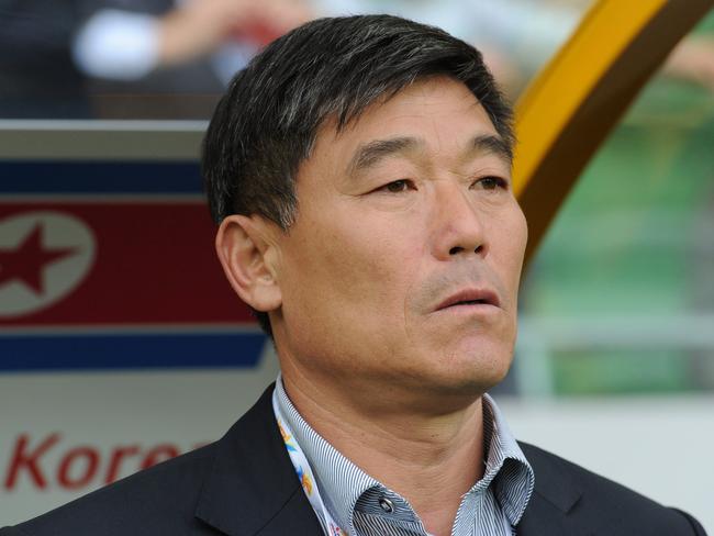 Tong Sop Jo, coach of North Korea, looks on during the Group B Asian Cup football match between North Korea and Saudi Arabia in Melbourne on January 14, 2015. AFP PHOTO / MAL FAIRCLOUGH -- IMAGE RESTRICTED TO EDITORIAL USE - STRICTLY NO COMMERCIAL USE