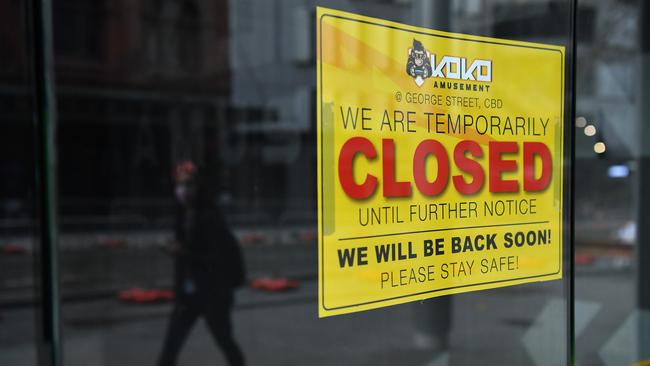 A sign is seen in the window of a Sydney business during one of the city’s lockdowns. Picture: NCA NewsWire / Joel Carrett