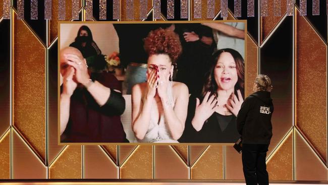 Andra Day, centre, reacts after winning the Best Actress Golden Globe. Picture: AFP