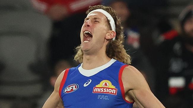 MELBOURNE, AUSTRALIA - APRIL 18: Aaron Naughton of the Bulldogs celebrates after scoring a goal during the round six AFL match between St Kilda Saints and Western Bulldogs at Marvel Stadium, on April 18, 2024, in Melbourne, Australia. (Photo by Robert Cianflone/Getty Images)