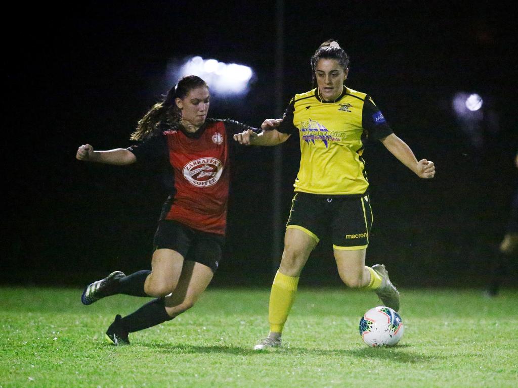 Lions' Alacia Lazarus lines up a tackle on Tigers' Gabrielle Nichol in the FNQ Football Premiership Women's match between the Edge Hill Tigers and the Lichhardt Lions, held at Tier Park, Manunda. Picture: Brendan Radke