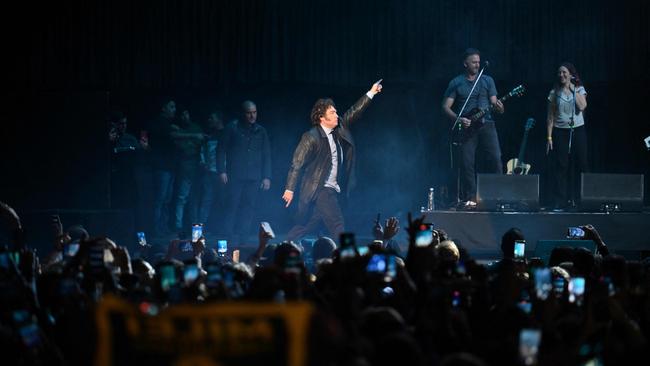 Milei dances at the Luna Park stadium in Buenos Aires on May 22, 2024. The President has been described as a combination of rock star and Tantric sex instructor. Picture: AFP