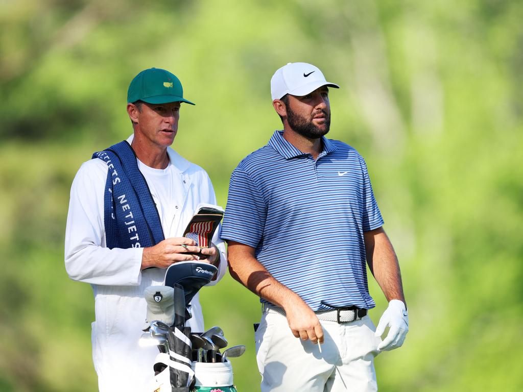 Scottie Scheffler and caddie Ted Scott prepare for a shot during the second round of the 2024 Masters Tournament. Picture: Getty Images