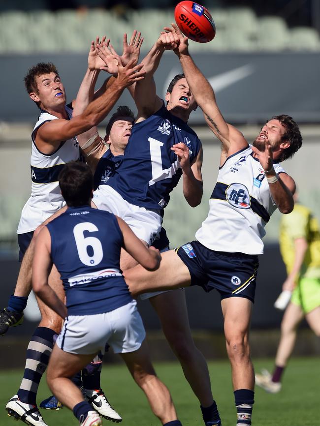 VAFA and NFL players contest a marking duel Picture: Andy Brownbill