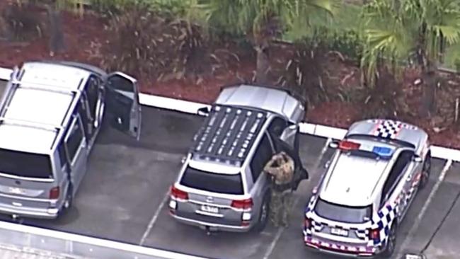 Police at the scene of the lockdown at Pimpama on the Gold Coast. Picture: Nine News.