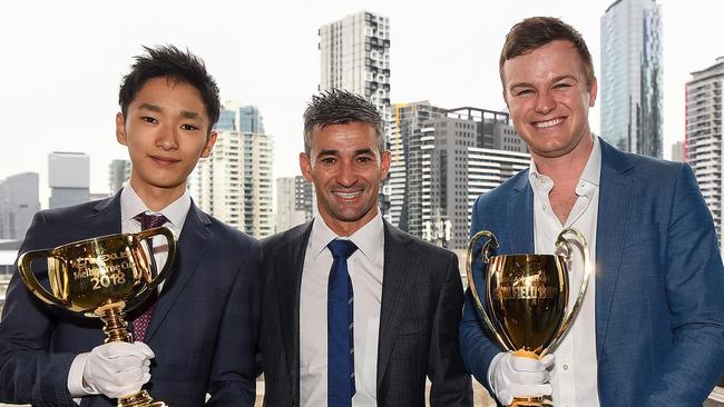 Leading japanese apprentice Ryusei Sakai with fellow jockey Corey Brown and trainer Ben Hayes at the release of the Caulfield and Melbourne Cup nominations.