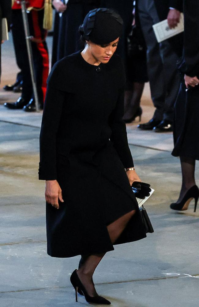 Meghan Markle curtsies as she pays her respects inside Westminster Hall, at the Palace of Westminster, where the coffin of Queen Elizabeth II, will Lie in State on a Catafalque. Picture: AFP.