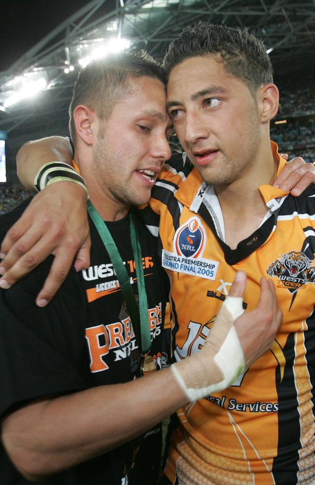 Scott Prince and Benji Marshall share a moment after their win in the 2005 grand final.