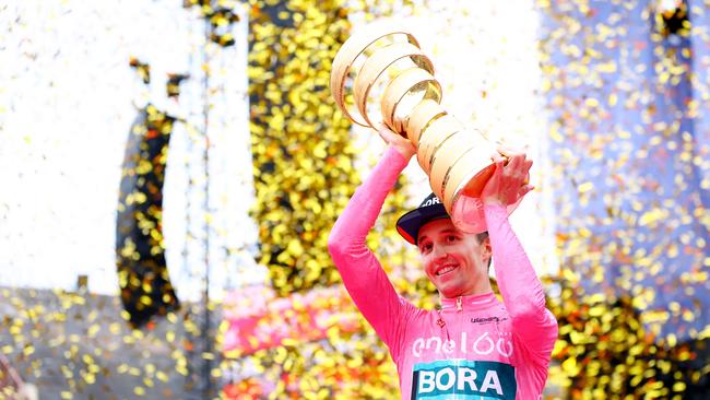 Jai Hindley celebrates on the podium. (Photo by Michael Steele/Getty Images)