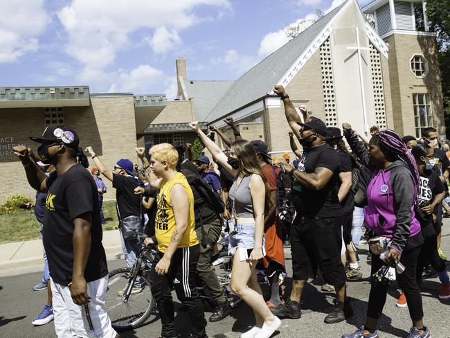 Black Lives Matter protesters march past the Grace Lutheran Church where Democratic Presidential nominee Joe Biden campaigned. Picture: Angus Mordant for NewsCorp Australia