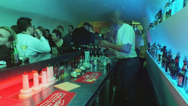 Customers wait to be served at the bar.