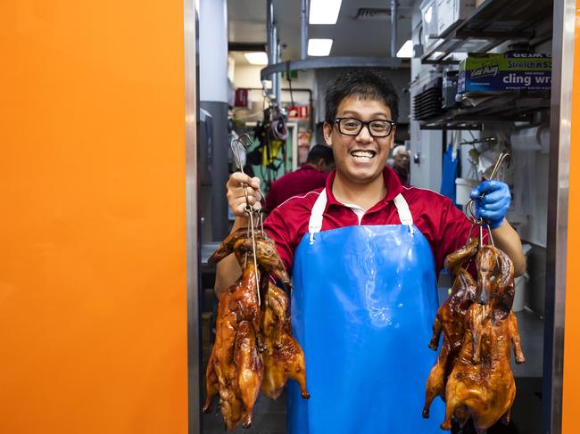 Kevin Nguyen with fresh Roasted Duck at Sunrise BBQ Butcher at Sunnybank. Picture: Lachie Millard