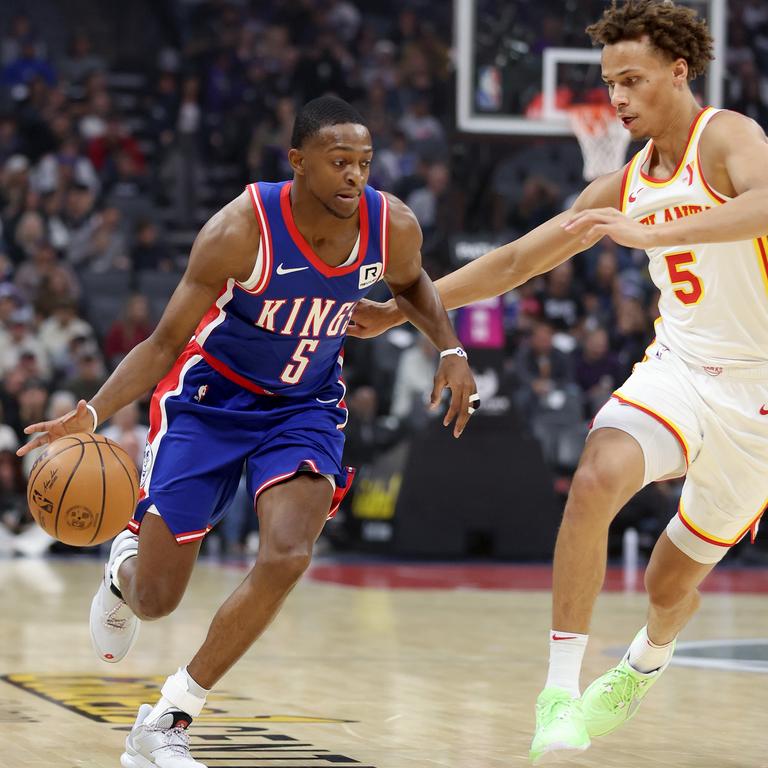 De'Aaron Fox, left, #5 of the Sacramento Kings, was closely guarded by Daniels in the first half and it proved to be a sign of things to come late in the game. Picture: Ezra Shaw/Getty Images