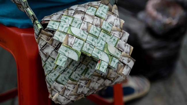 Close-up of a purse made by Venezuelan Wilmer Rojas, out of Bolivar banknotes in Caracas. (Image: AFP/ Federico Parra)