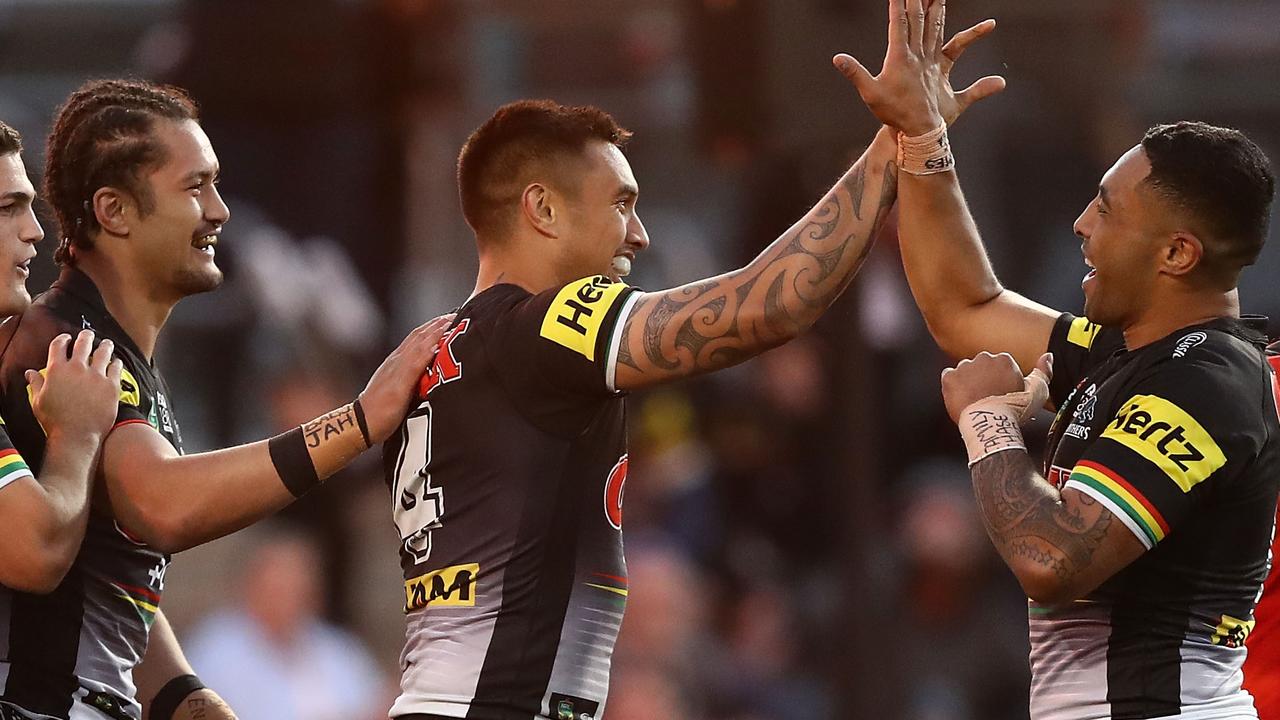 Dean Whare of the Panthers celebrates after scoring a try.