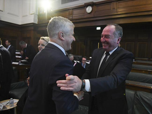 Australian Deputy Prime Minister Michael McCormack (left) shakes hands with Drought Envoy Barnaby Joyce during the National Drought Summit at Old Parliament House in Canberra, Friday, October 26, 2018.  (AAP Image/Lukas Coch) NO ARCHIVING