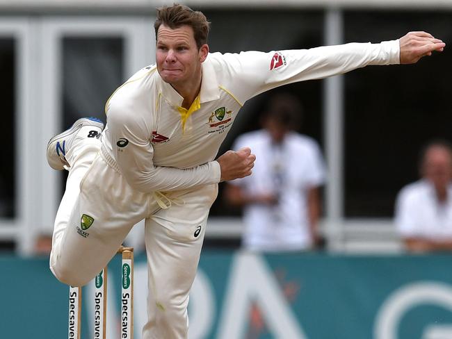 Australia's Steve Smith bowls on day one of the three day friendly cricket match between Derbyshire and Australia at the County Ground in Derby, central England on August 29, 2019. (Photo by Paul ELLIS / AFP) / RESTRICTED TO EDITORIAL USE. NO ASSOCIATION WITH DIRECT COMPETITOR OF SPONSOR, PARTNER, OR SUPPLIER OF THE ECB