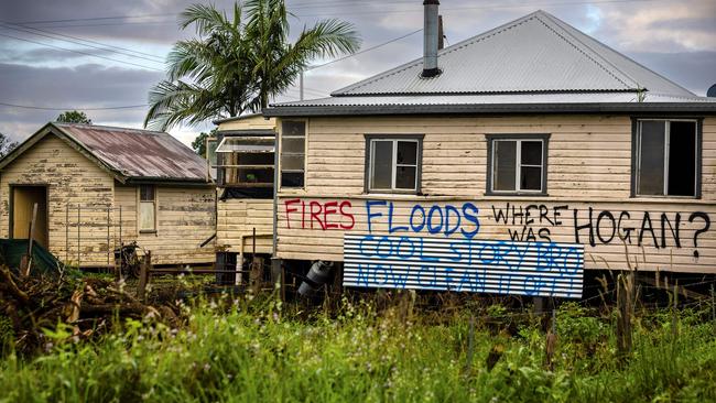 This photo taken on May 15, 2022, shows houses with political graffiti after the floods devastated Lismore. Picture: Patrick Hamilton / AFP