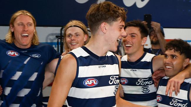 GEELONG, AUSTRALIA - APRIL 14: Debutant, Connor O'Sullivan of the Cats sings the team song during the 2024 AFL Round 05 match between the Geelong Cats and the North Melbourne Kangaroos at GMHBA Stadium on April 14, 2024 in Geelong, Australia. (Photo by Michael Willson/AFL Photos via Getty Images)