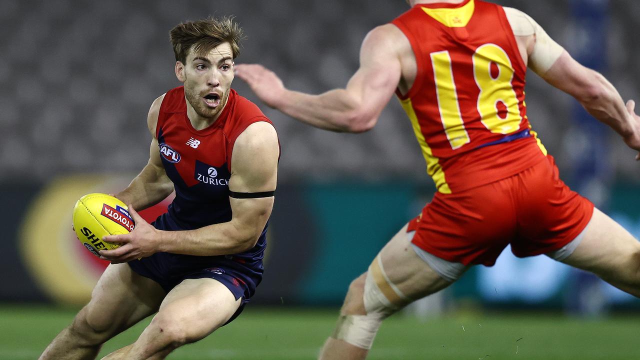 AFL Round 20. Gold Coast Suns v Melbourne at Marvel Stadium, Melbourne. 01/08/2021. Jack Viney of the Demons tries to avoid Matthew Rowell of the Suns . Pic: Michael Klein