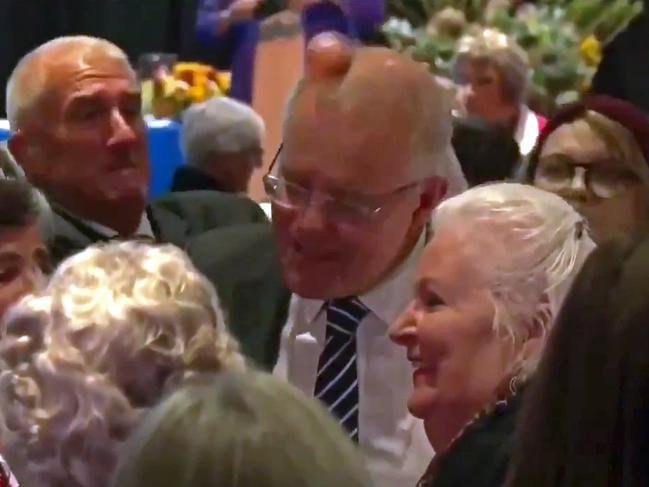 Prime Minister Scott Morrison is "egged" by an activist as he visits the Country Women's Association State Conference (CWA) of NSW. Picture: Seven News