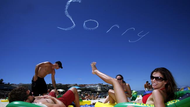 January 26, 2008, a plane writes SORRY across the skies over Bondi on Australia Day. Picture: Warren Clarke.