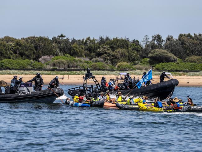 NSW Police stop climate protesters who paddle out to the shipping channel during the People's Blockade on November 24, 2024 in Newcastle. Picture: Getty Images