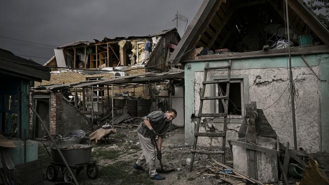 A man cleans his destroyed house from debris after a strike in the city of Dobropillia in the eastern Ukrainian region of Donbas on June 15. Picture: Aris Messinis/AFP