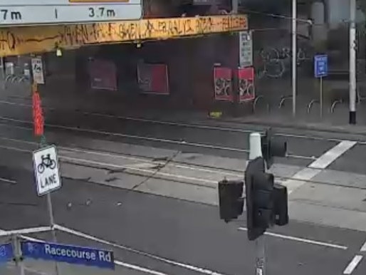 Racecourse Rd in Kensington has been closed in both directions under the Newmarket rail bridge between Bellair Street and Pin Oak Crescent after an over height truck brought down overhead wires on Monday morning.