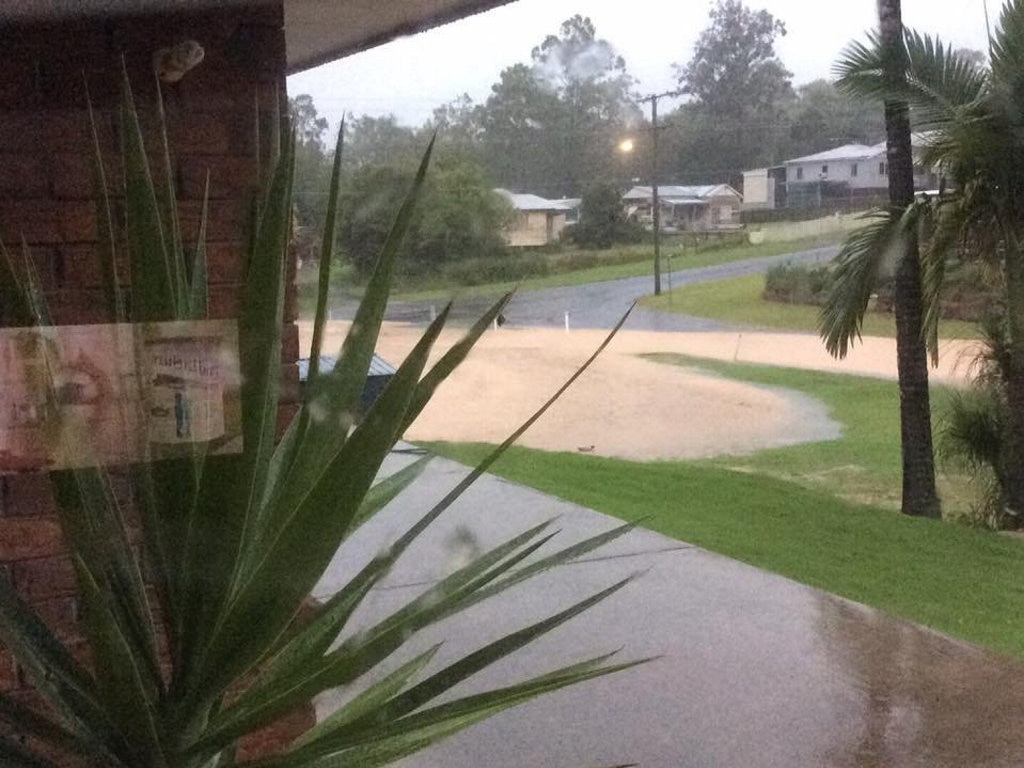 Water over the road in Alice and Short Street, Blackstone. Picture: FACEBOOK/ Kym Wellen