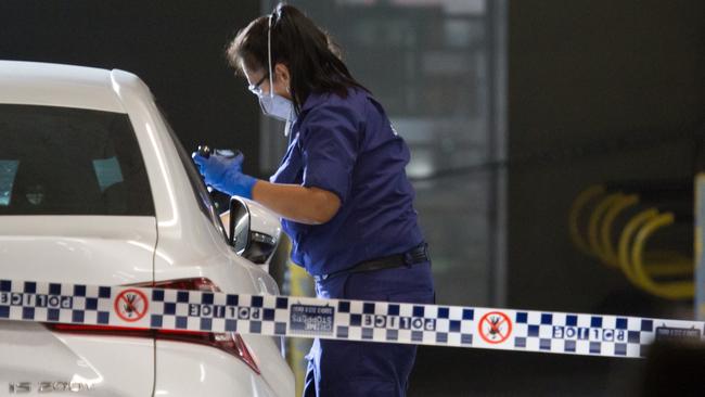 Forensic crews search for fingerprints Pic: Damian Hofman