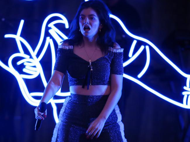 Lorde also wore the rainbow flag at one point at the Sydney Opera House Forecourt. Picture: Christian Gilles