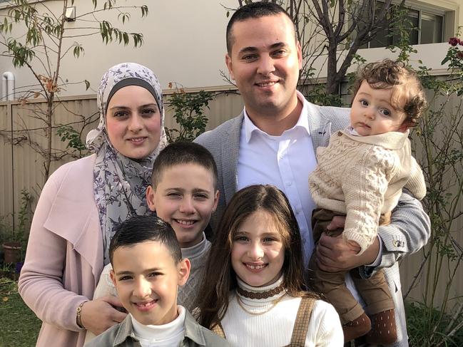 CBX: Eid celebrations: Greenacre's Bilal El-Hayek celebrates Eid with family. Wife Mayson, children: Adam, front, Tasnim (girl), Mustapha and Noah, 6 months, in his arms.Bilal is a local councilor. Picture: Lawrence Machado