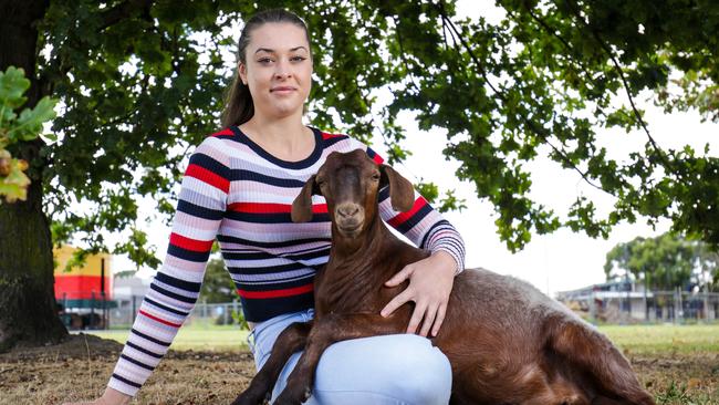 Cara Garrett, with her pet goat Jo, was fined $1 for taking an identity tag from a stolen goat. Picture: Nicole Cleary