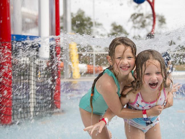 Tahlia, 8, and Isabelle, 5, enjoying the splash area at the Oak Park Sports and Aquatics Centre