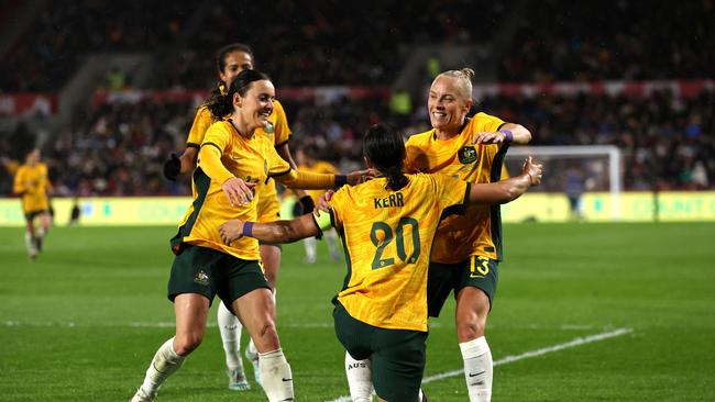 Sam Kerr is congratulated by teammates Hayley Raso (right) and Tameka Yallop (left) after scoring for the Matildas. Picture: Ryan Pierse/Getty Images