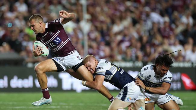 SYDNEY, AUSTRALIA - MARCH 08: Tom Trbojevic of the Sea Eagles makes a break during the round one NRL match between Manly Sea Eagles and North Queensland Cowboys at 4 Pines Park, on March 08, 2025, in Sydney, Australia. (Photo by Cameron Spencer/Getty Images)