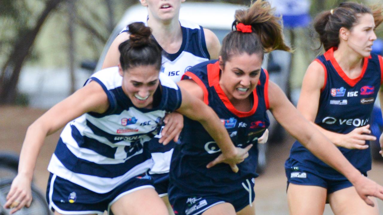 South Adelaide v Norwood SANFLW game at Noarlunga, Saturday, April 20, 2019. Souths Cheyenne Hammond and Norwood's Jessica Macolino battle for the ball. (AAP Image/Brenton Edwards)