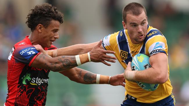 Clint Gutherson fends off Tristan Sailor during the Eels v Dragons clash at the NRL Nines