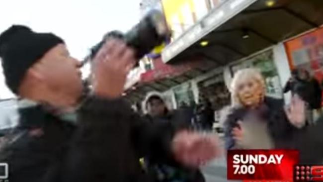 “Hey, hey, hey”: 60 Minutes reporter Liz Hayes raises her hands and appeals for calm as the attack on her colleague unfolds. <i>Picture: Supplied by Channel 9</i>