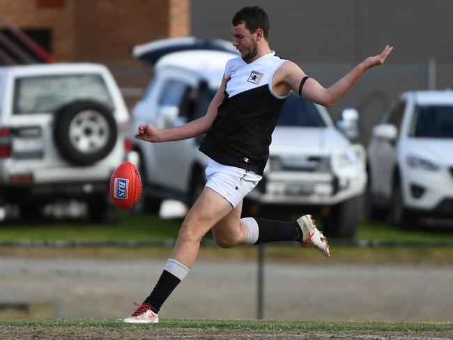 Ringwood ruckman Ben Power gets a kick away. Picture: James Ross/AAP