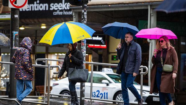 Wet weather photos: People on the streets in the city of Adelaide with umbrellas to shelter from the rain, on June 29th, 2024. Picture: Tom Huntley