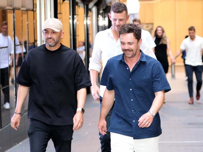 Nathan Lyon, Josh Hazelwood and Travis Head arrive. Picture: Damian Shaw