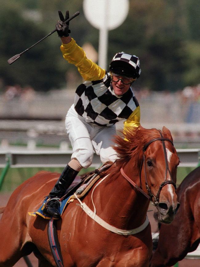 Darren Beadman salutes the crowd after urging Saintly to his 1996 Melbourne Cup win. Picture: Andrew Tauber