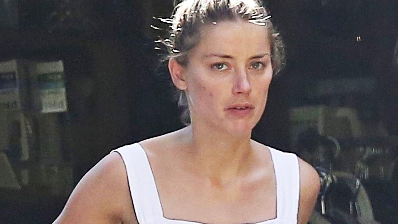 Amber Heard Has Wardrobe Malfunction In Loose Fitting Dress Photos