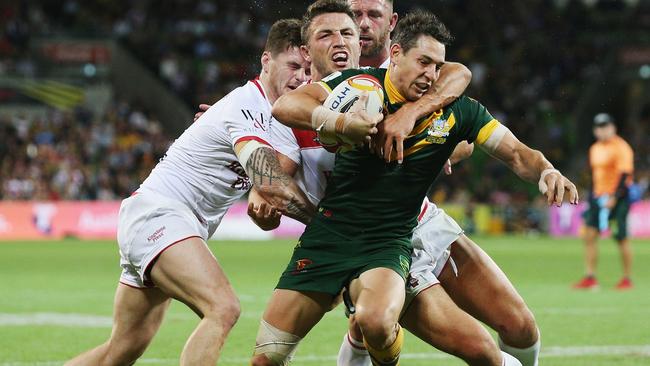 Billy Slater busts through the England defence to score a try for the Kangaroos.